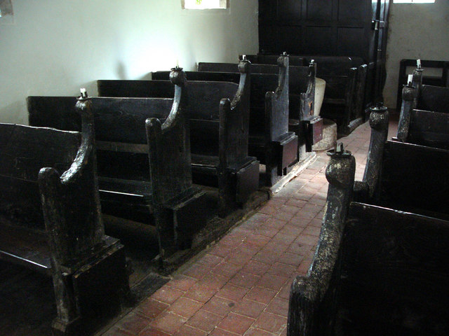 Candle holders on the pews for lighting, Didling Church