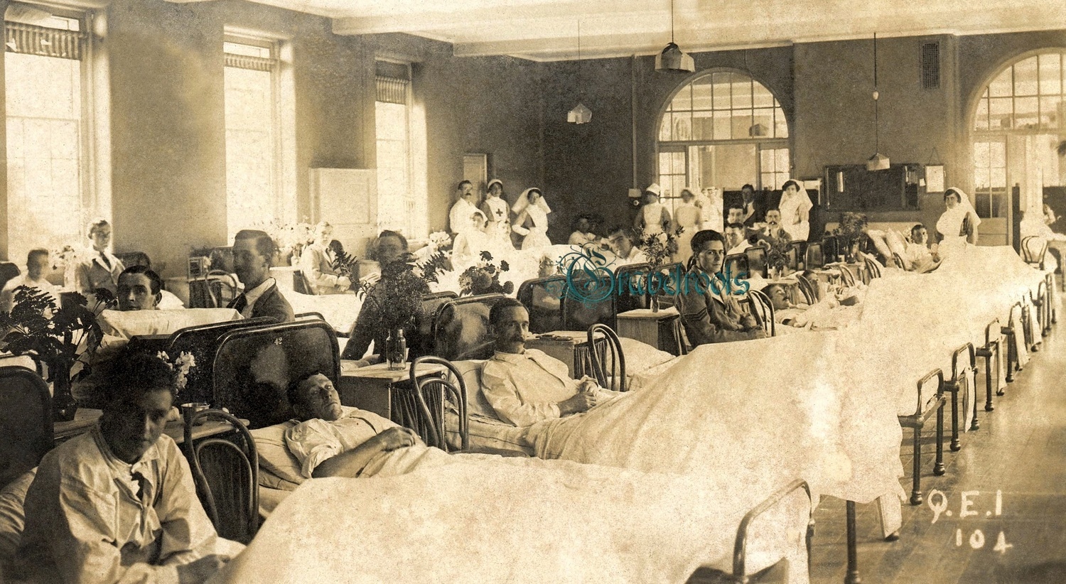old photo of Queens Ward, QE1, Graylingwell War Hospital, Chichester, Sussex<br>Note cigarettes in a couple of patients mouths - click image to return